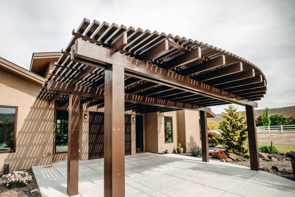 brown pergola installed by Patio Covers Unlimited